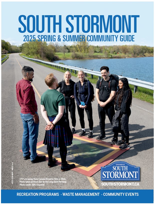 Group of people standing on road of Long Sault Parkway